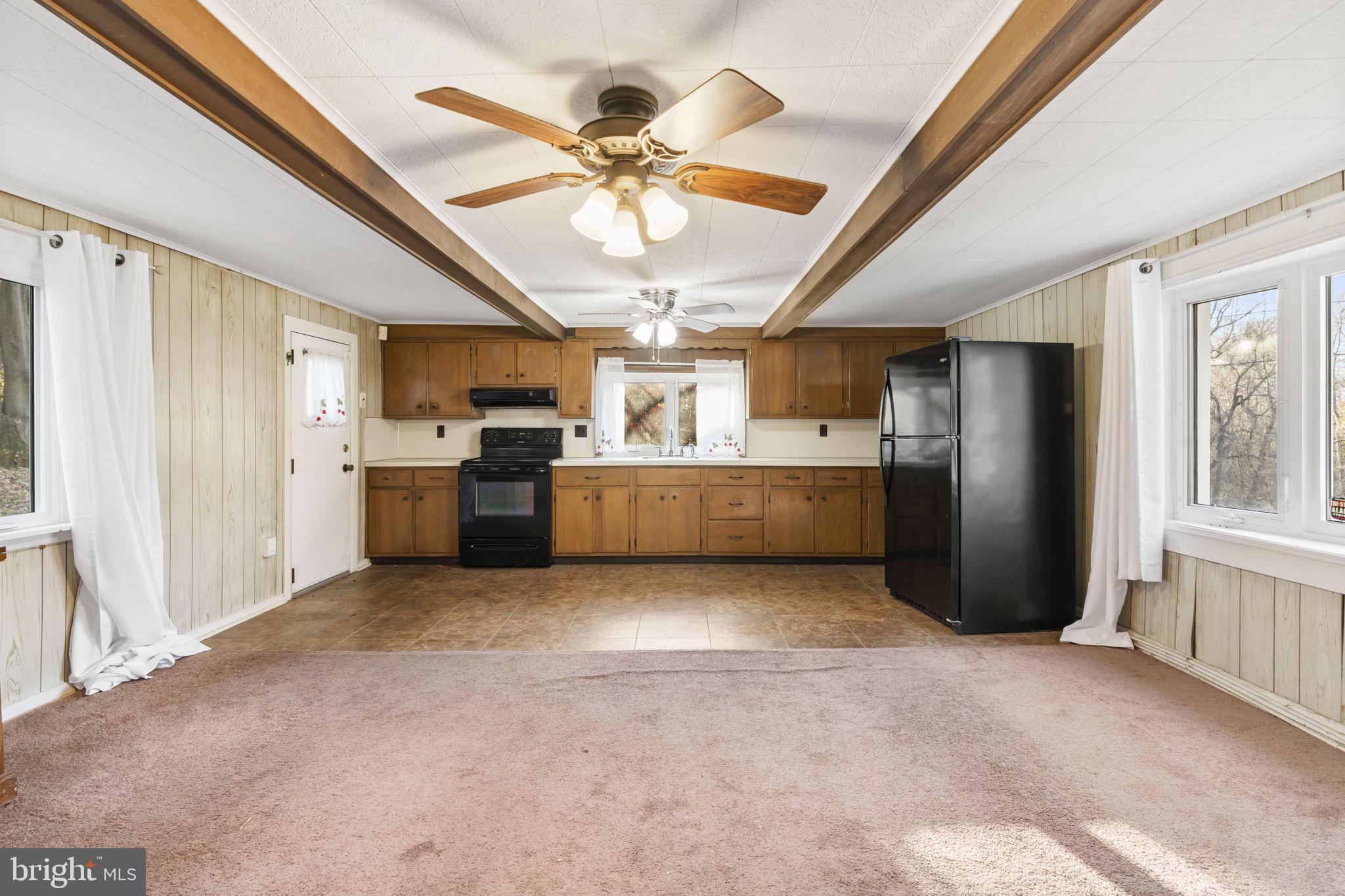 198 Glenrose Road Coatesville, PA 19320 - Photo 13 of 43 a view of a kitchen with a microwave and a kitchen view