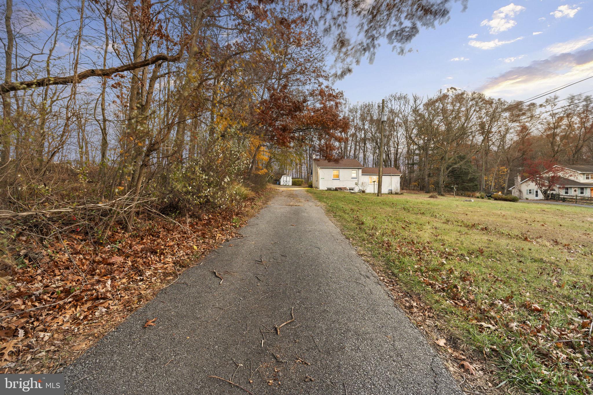 198 Glenrose Road Coatesville, PA 19320 - Photo 2 of 43 a view of a yard with trees on both side of it