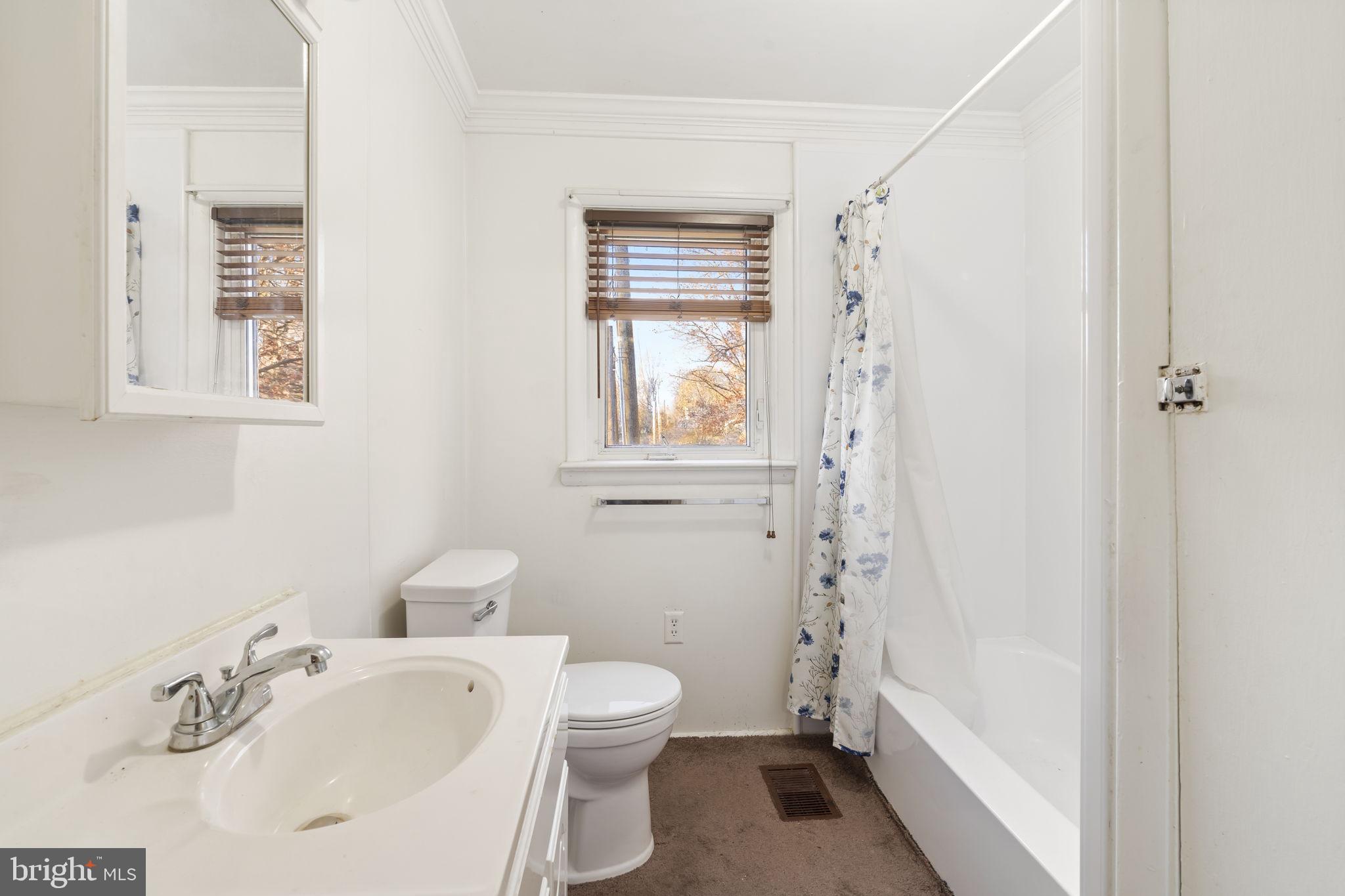 198 Glenrose Road Coatesville, PA 19320 - Photo 23 of 43 a bathroom with a sink toilet and shower