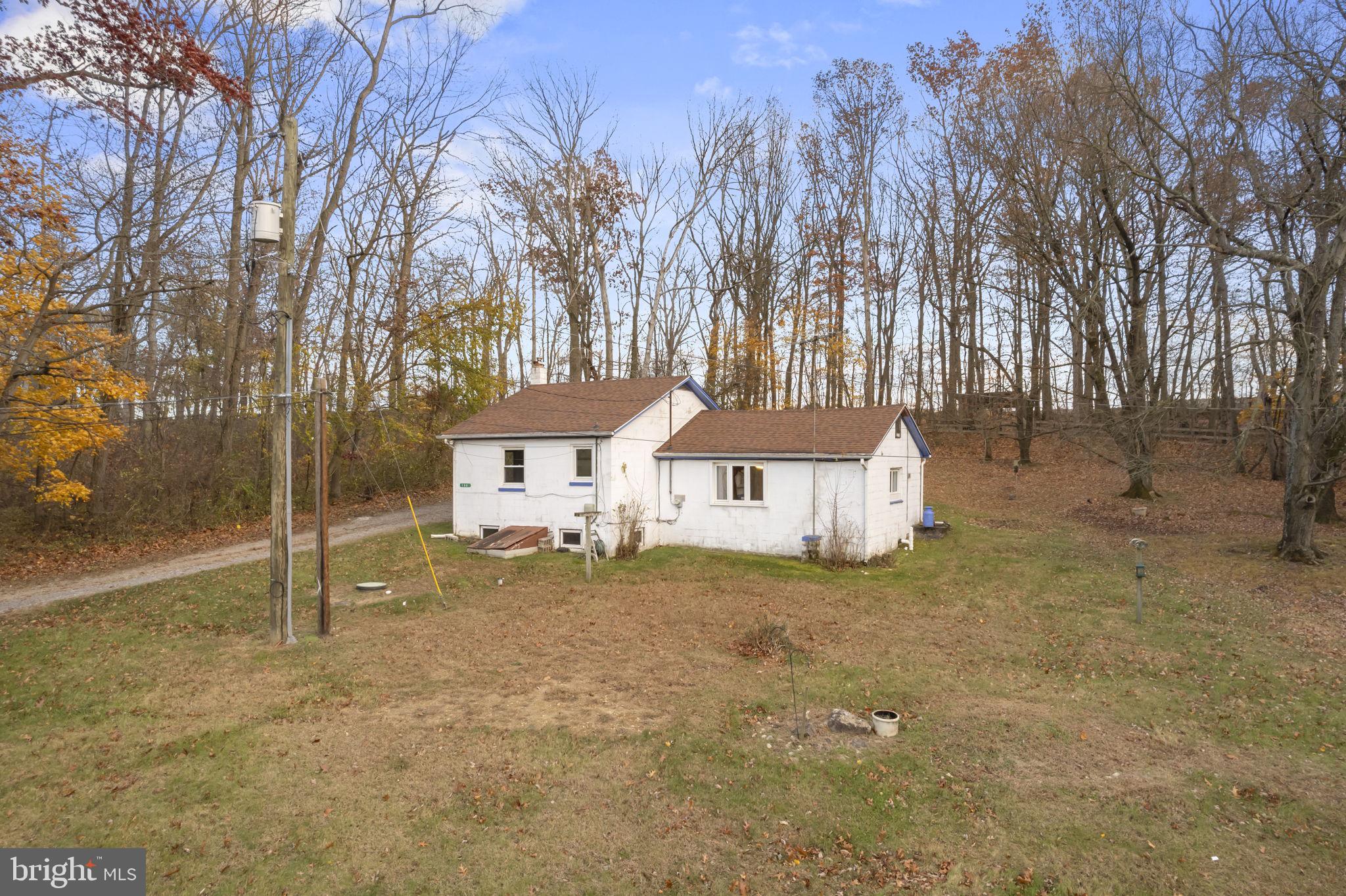 198 Glenrose Road Coatesville, PA 19320 - Photo 5 of 43 a white house that has a tree in front of it