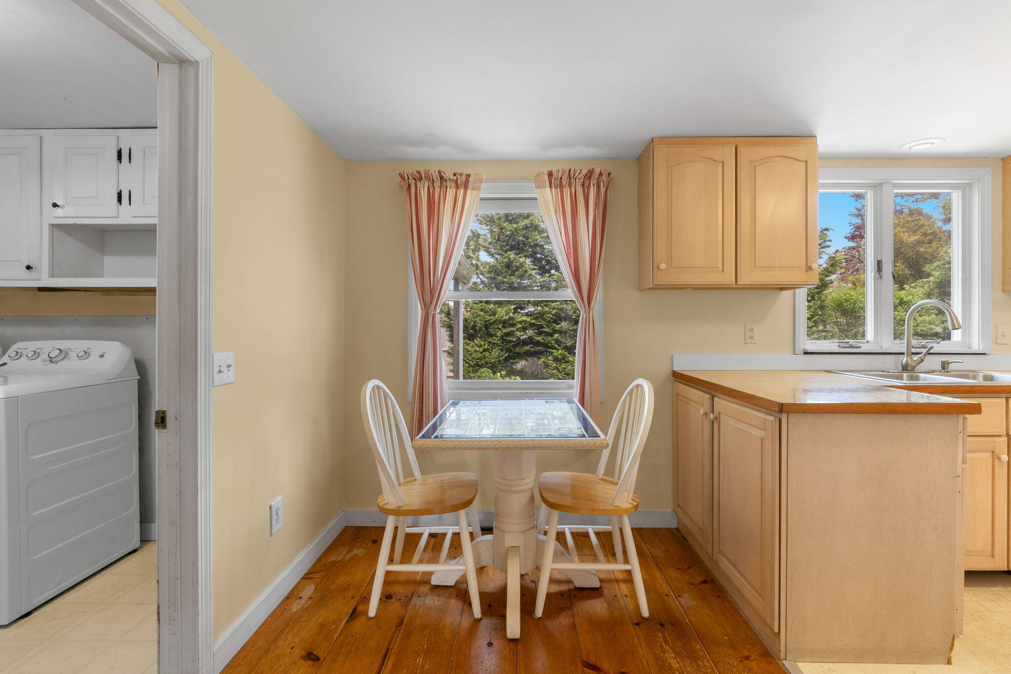 7 Aunt Matties Road Chatham, MA 02633 - Photo 15 of 37 a view of a kitchen with kitchen island wooden floors and stainless steel appliances