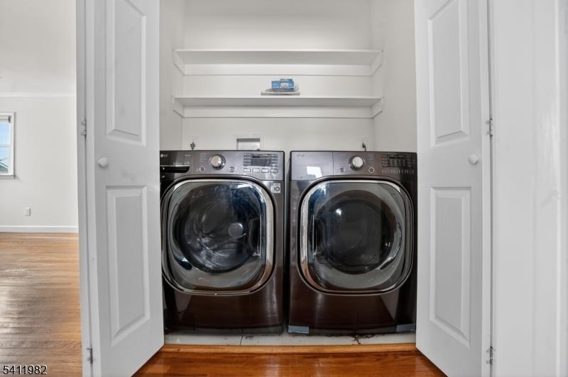 16 George Street, Unit 2 Bayonne, NJ 07002 - Photo 4 of 10 a room with washer and dryer