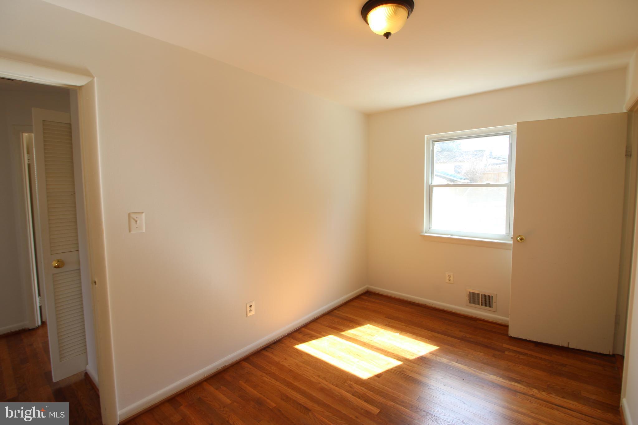 4416 Randolph Road Silver Spring, MD 20906 - Photo 16 of 27 a view of empty room with wooden floor and fan