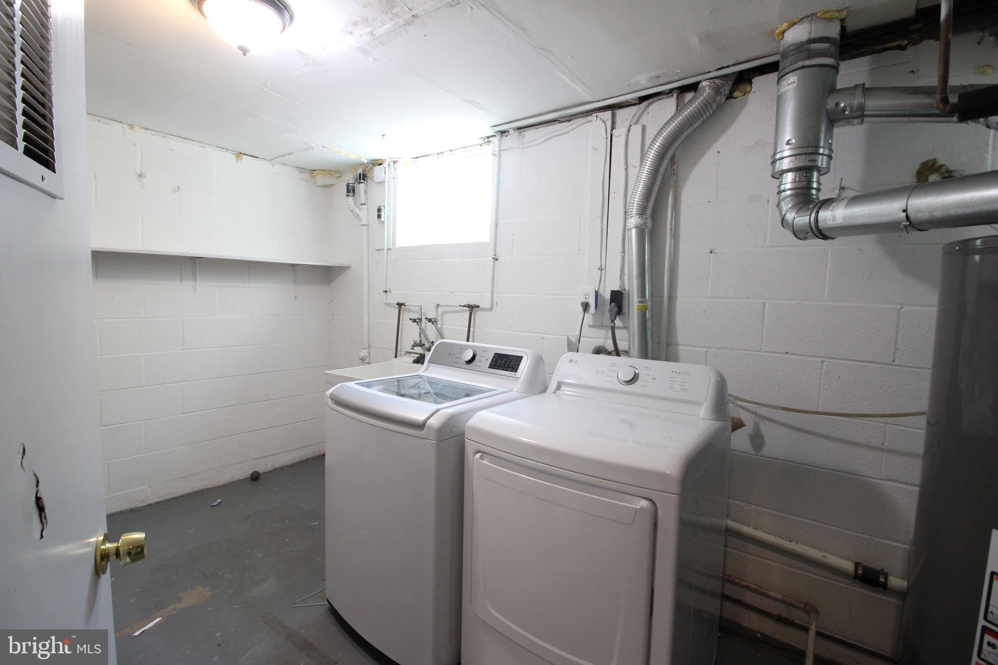 4416 Randolph Road Silver Spring, MD 20906 - Photo 18 of 27 a utility room with dryer and washer