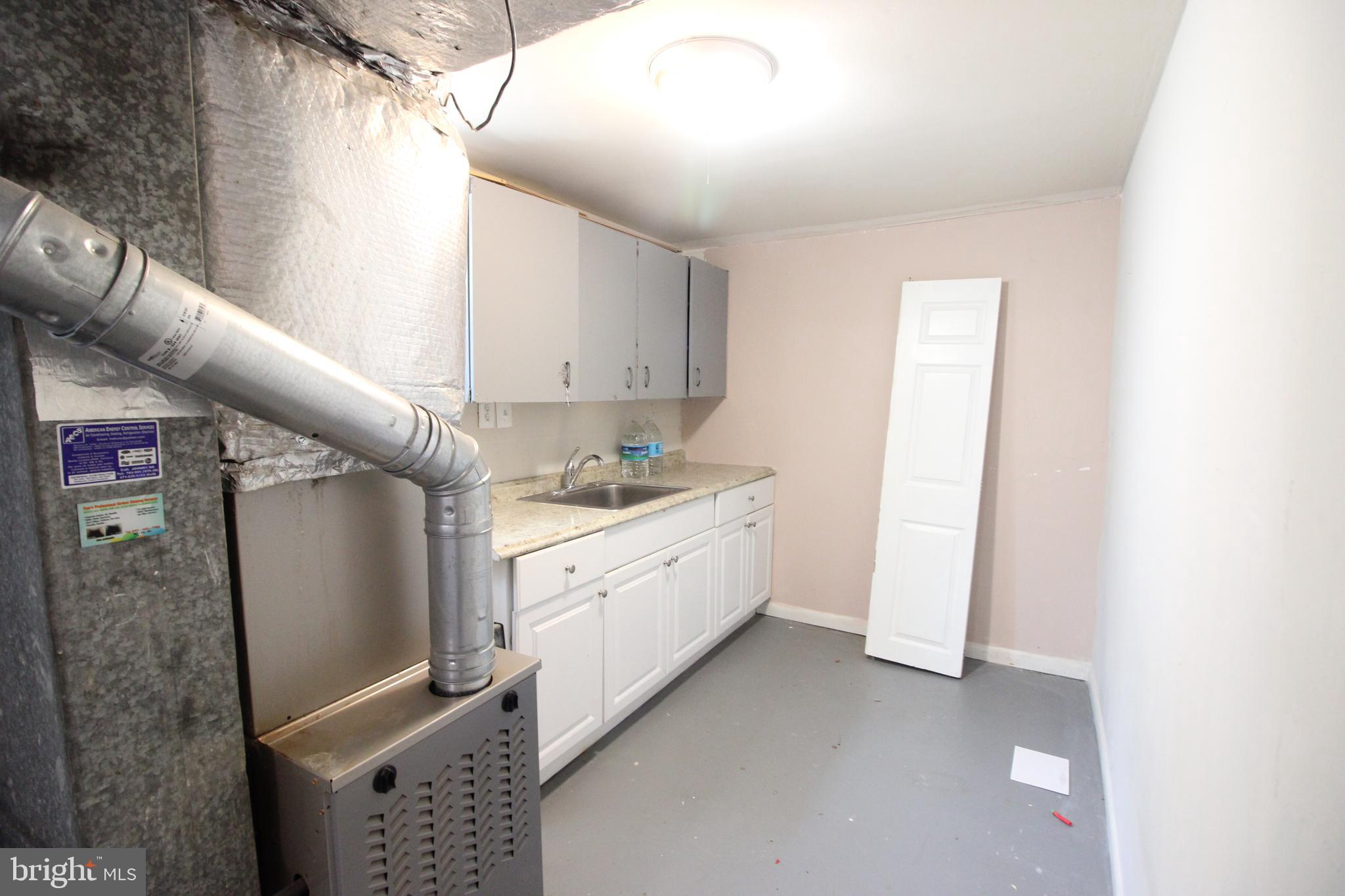 4416 Randolph Road Silver Spring, MD 20906 - Photo 19 of 27 a kitchen with stainless steel appliances granite countertop a refrigerator and a stove