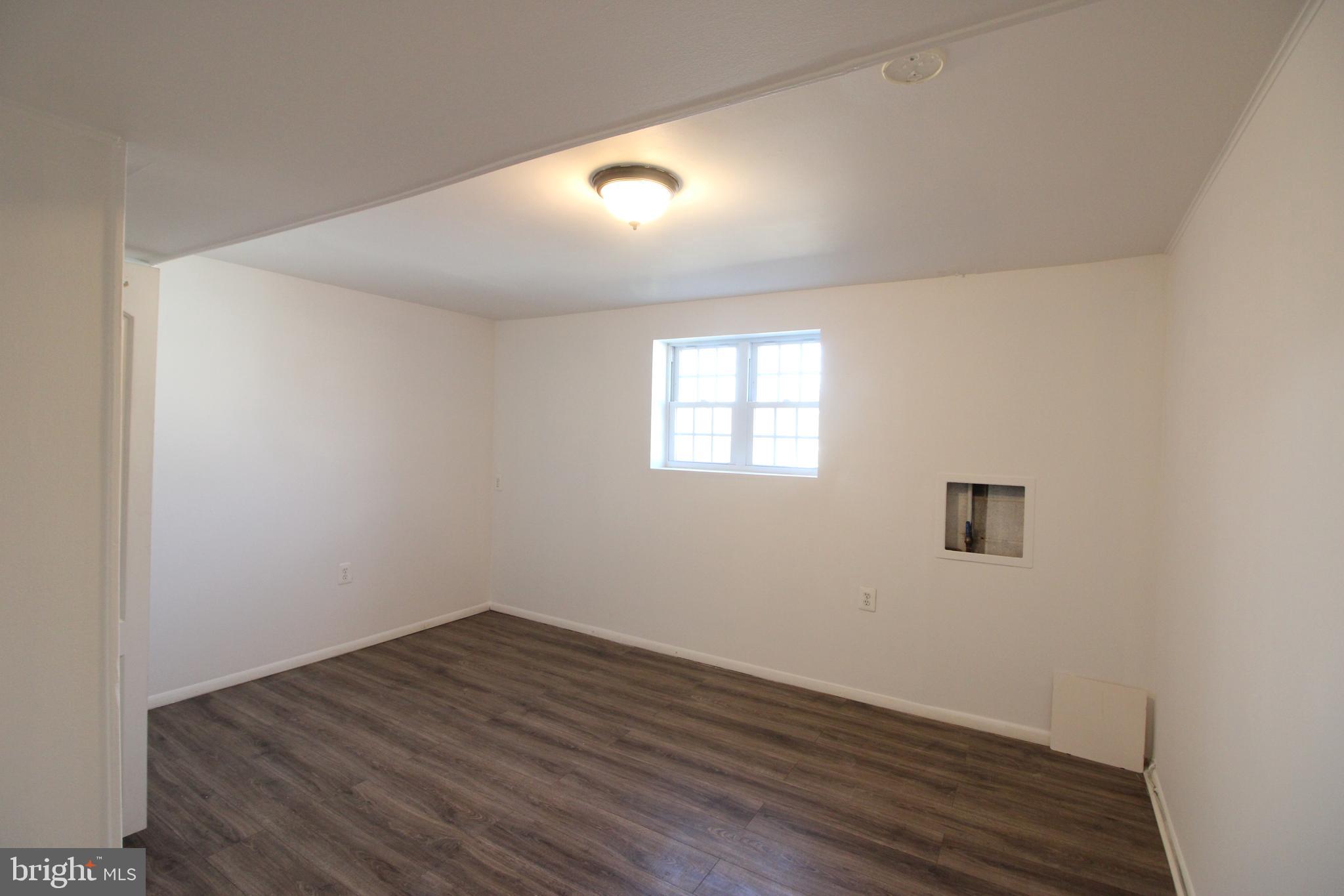 4416 Randolph Road Silver Spring, MD 20906 - Photo 22 of 27 a view of empty room with wooden floor and fan