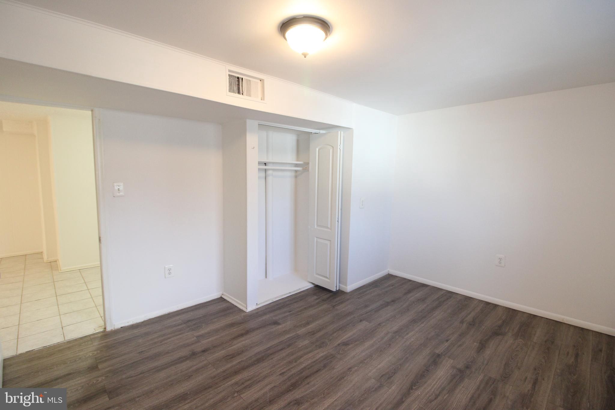 4416 Randolph Road Silver Spring, MD 20906 - Photo 23 of 27 a view of an empty room with wooden floor