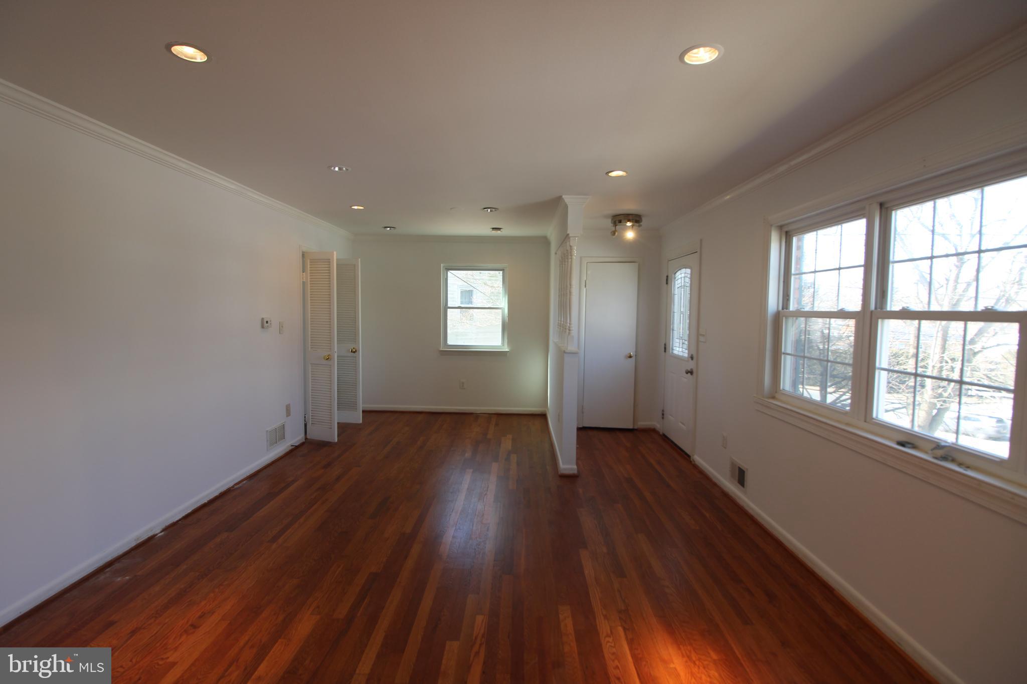 4416 Randolph Road Silver Spring, MD 20906 - Photo 4 of 27 a view of an empty room with wooden floor and window