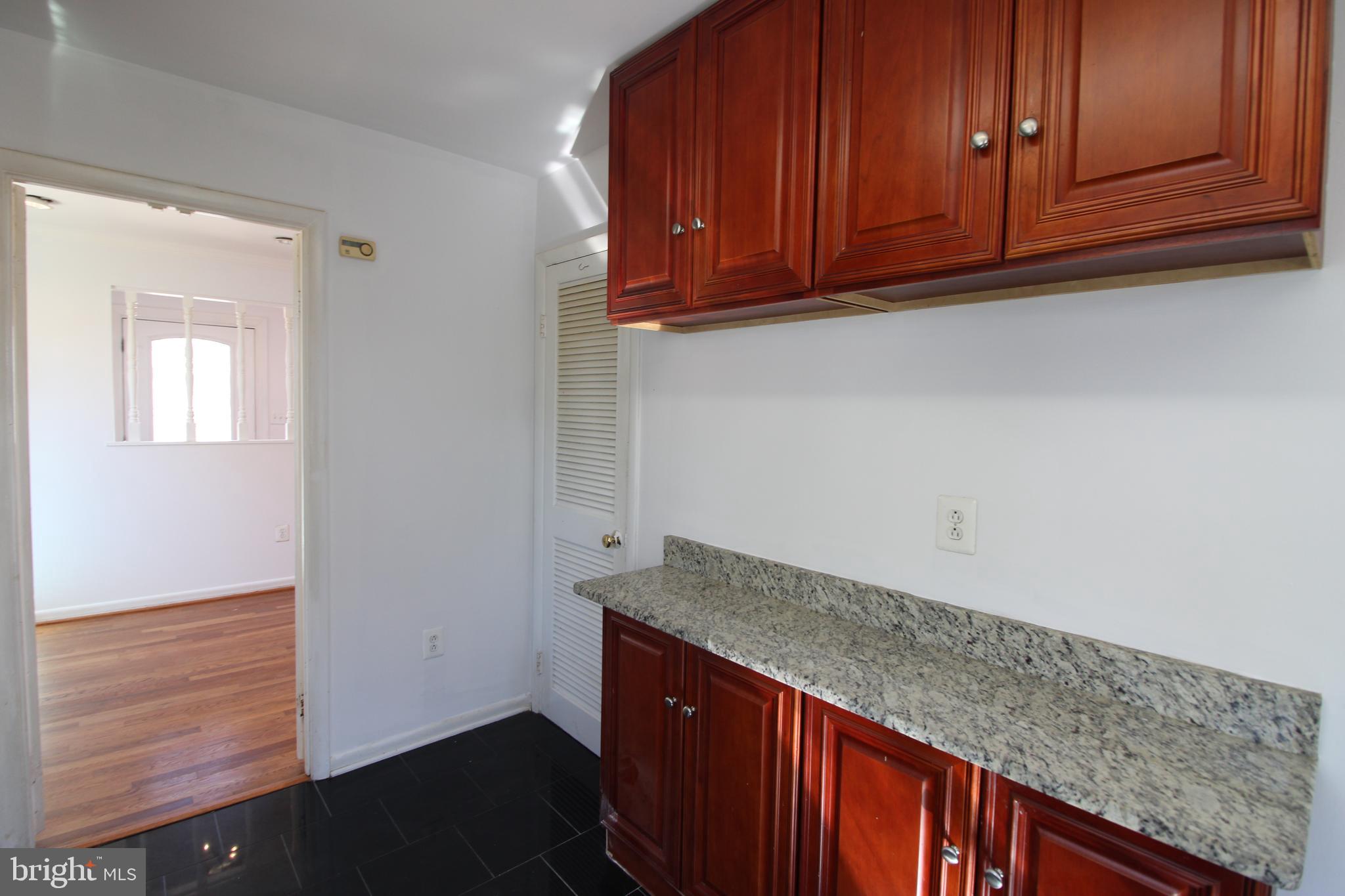 4416 Randolph Road Silver Spring, MD 20906 - Photo 9 of 27 a view of cabinets and wooden floor
