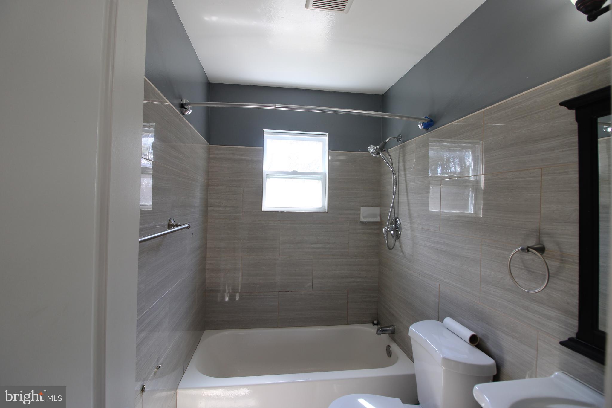 4416 Randolph Road Silver Spring, MD 20906 - Photo 10 of 27 a bathroom with a toilet and a shower