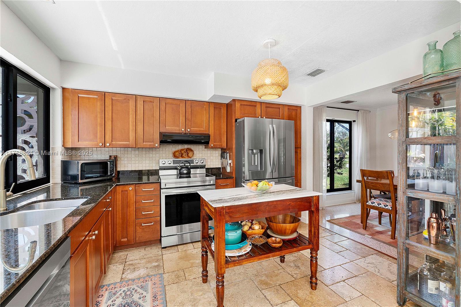 3700 West Park Road Hollywood, FL 33021 - Photo 8 of 45 a kitchen with stainless steel appliances granite countertop a stove top oven a sink dishwasher and cabinets with wooden floor