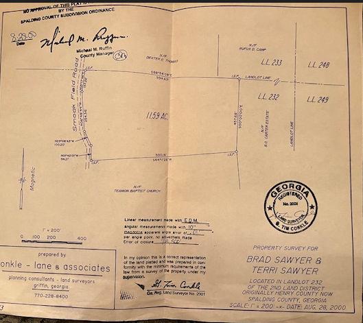 176 Smoak Field Road Griffin, GA 30223 - Photo 13 of 13 a view of a wall with a clock on it