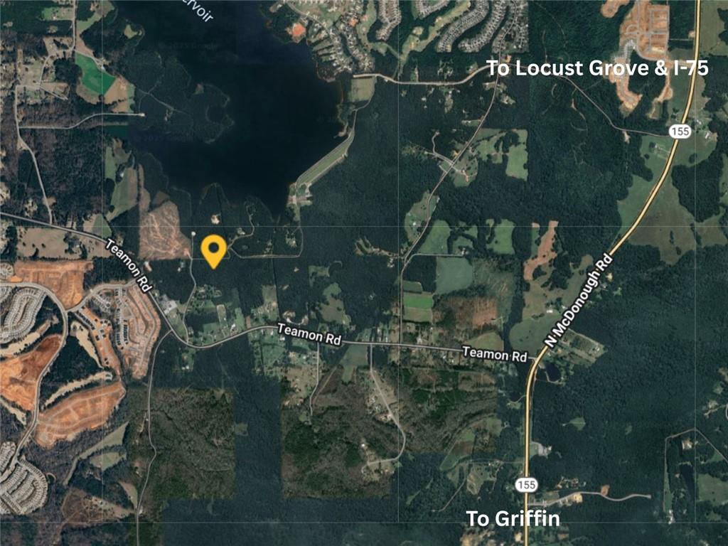 176 Smoak Field Road Griffin, GA 30223 - Photo 9 of 13 a backyard of a house with table and chairs