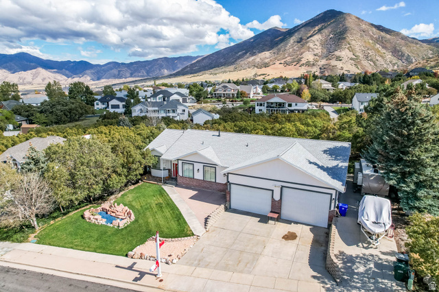 569 Elk Meadow Loop Tooele, UT 84074 - Photo 47 of 56 Aerial view of residential area featuring a mountain backdrop