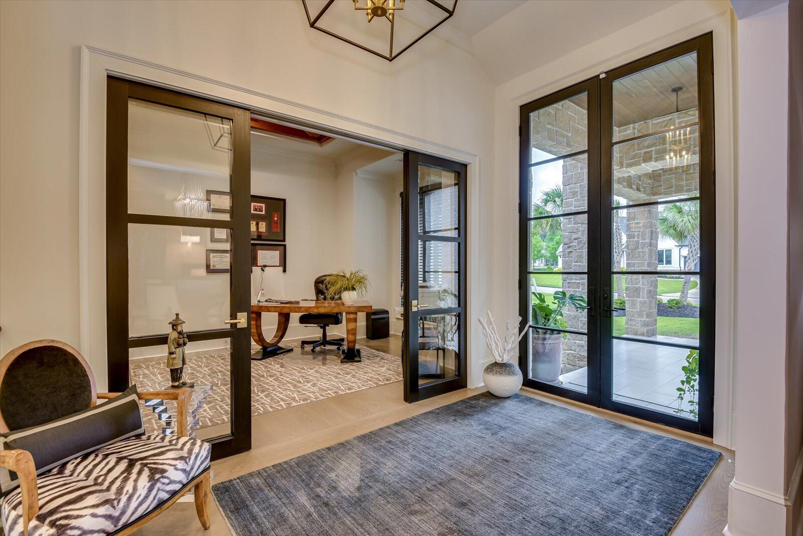 2025 Grace Avenue Evans, GA 30809 - Photo 11 of 70 Office with custom built cabinets, Colorado cedar beams in the trey ceiling. Glass wood sliding door.