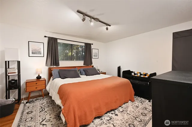 a bedroom with bed and a window