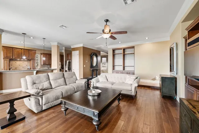 a living room with furniture fireplace and a flat screen tv