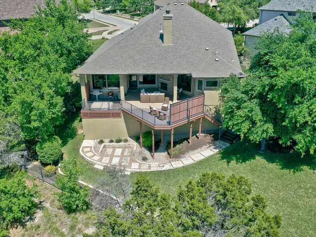 a bedroom with a bed window and a flat screen television
