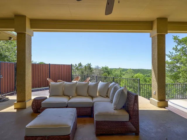 a view of a hallway with wooden floor windows and livingroom