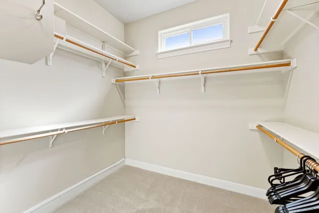 a bathroom with a granite countertop sink a mirror and a shower