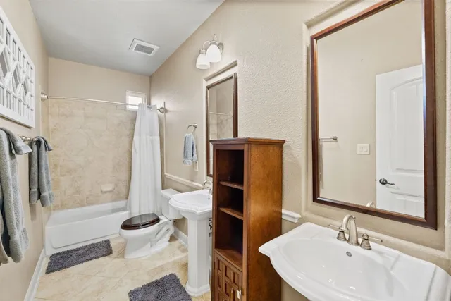 a view of a balcony with a yard