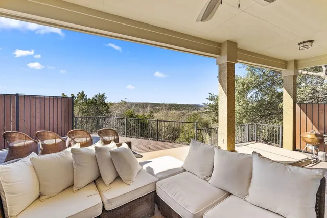 a view of a city with lush green forest