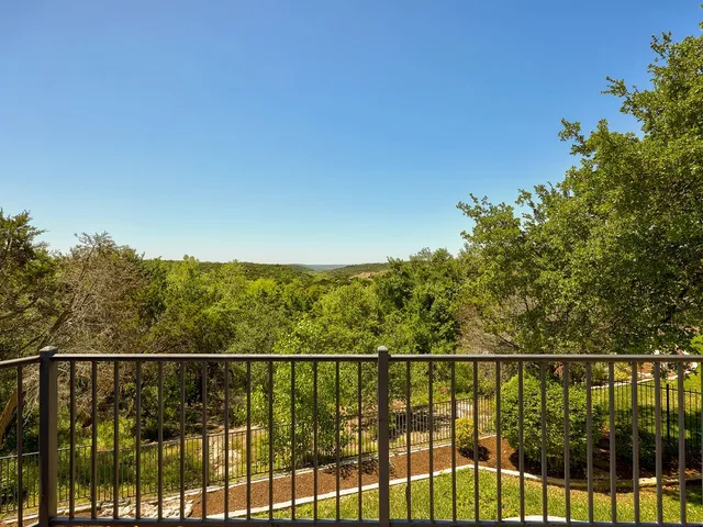 a view of a chairs and table in patio