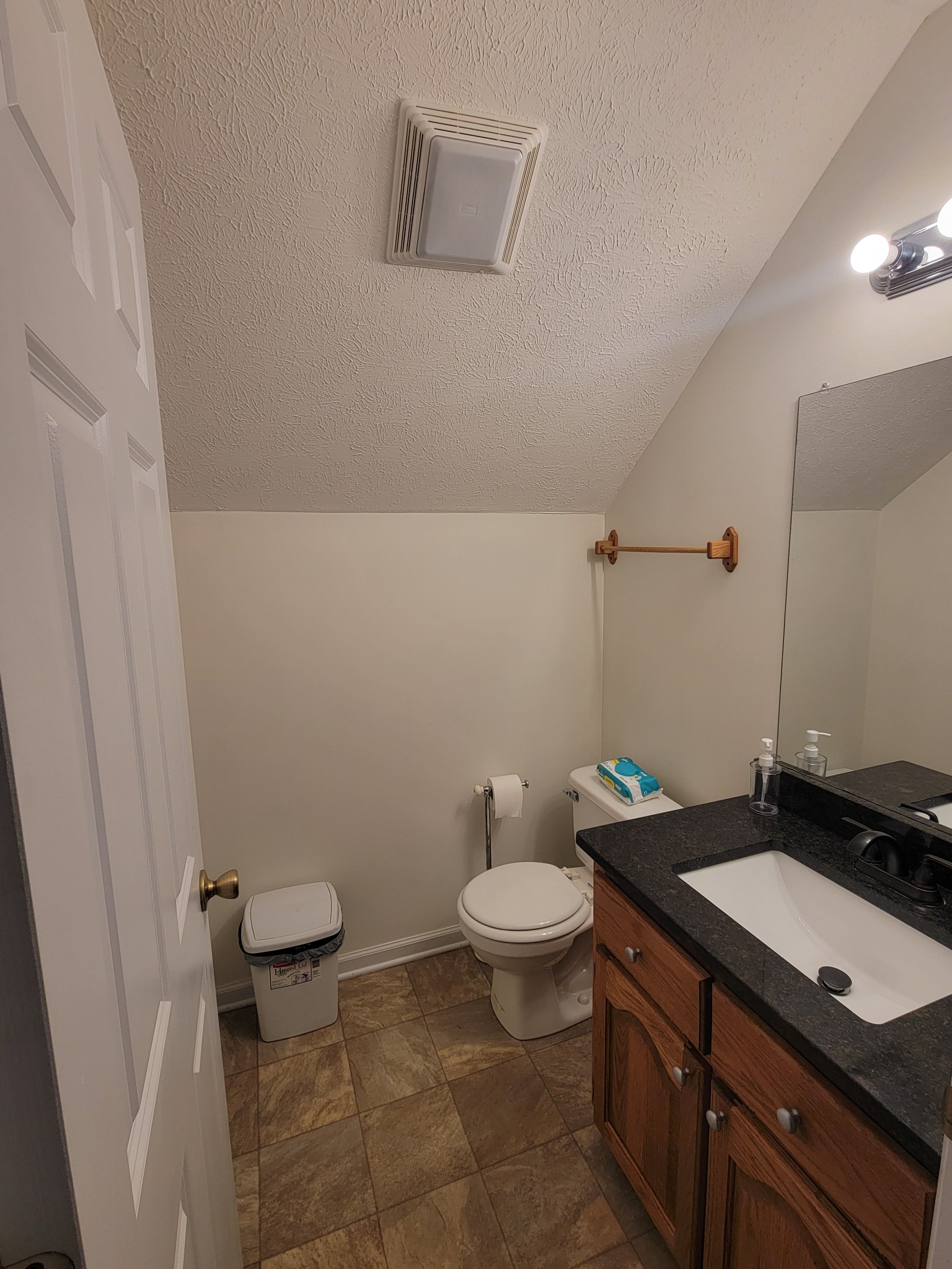 575 Haywood Creek Road Pulaski, TN 38478 - Photo 18 of 29 a bathroom with a granite countertop sink a toilet and a mirror