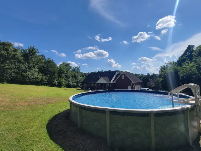 a backyard of a house with outdoor seating