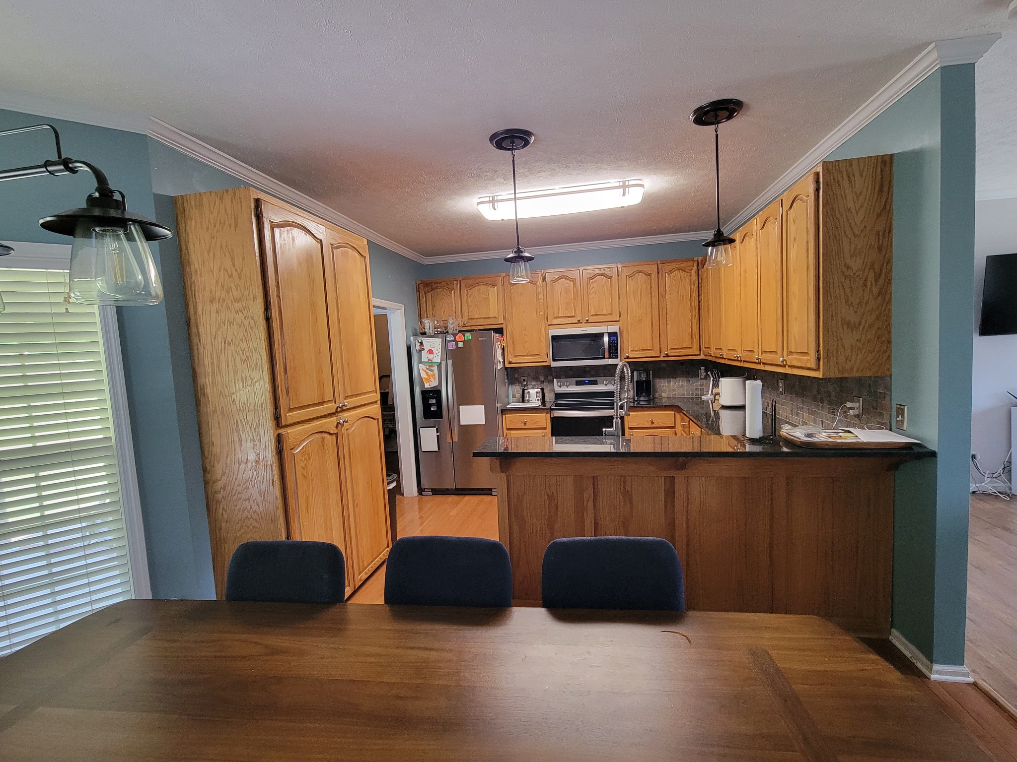 575 Haywood Creek Road Pulaski, TN 38478 - Photo 5 of 29 a kitchen with stainless steel appliances a refrigerator and a stove top oven