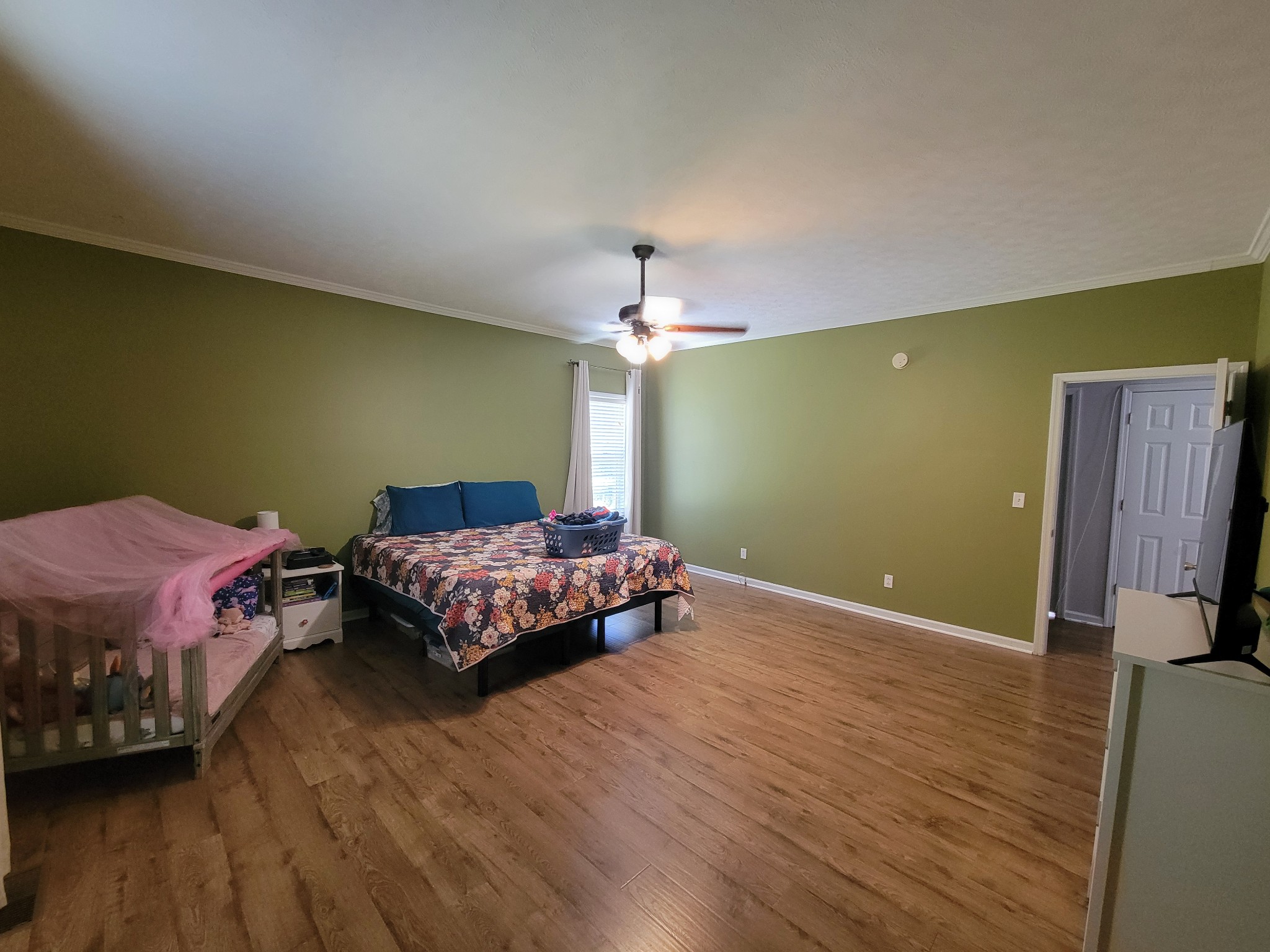 575 Haywood Creek Road Pulaski, TN 38478 - Photo 9 of 29 a bedroom with a bed and wooden floor
