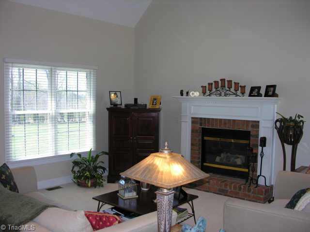 7493 Bethel View Court Oak Ridge, NC 27310 - Photo 4 of 9 Other. Living Room With Vaulted Ceiling & Gas Log Fireplace