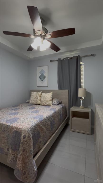 4710 North Ebony Street Pharr, TX 78577 - Photo 12 of 12 a bedroom with a bed and a ceiling fan