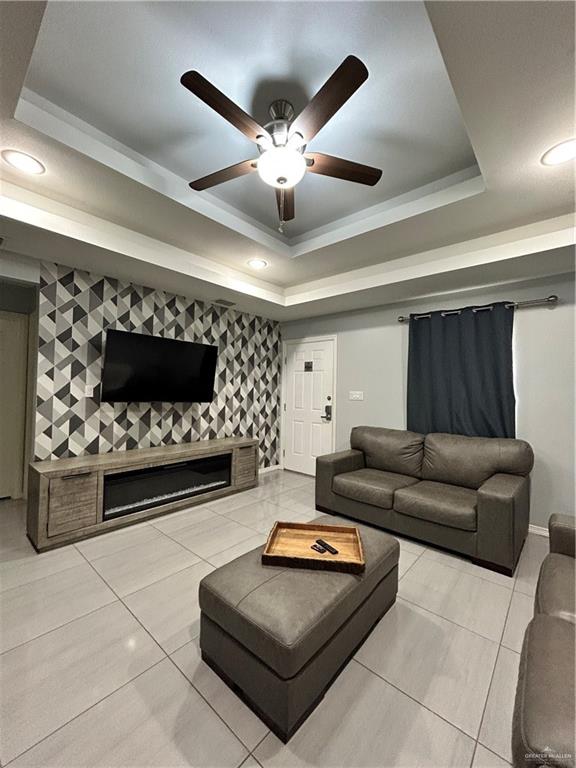 4710 North Ebony Street Pharr, TX 78577 - Photo 2 of 12 a living room with furniture and a fireplace