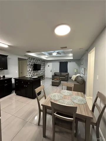 a kitchen with a table and chairs in it