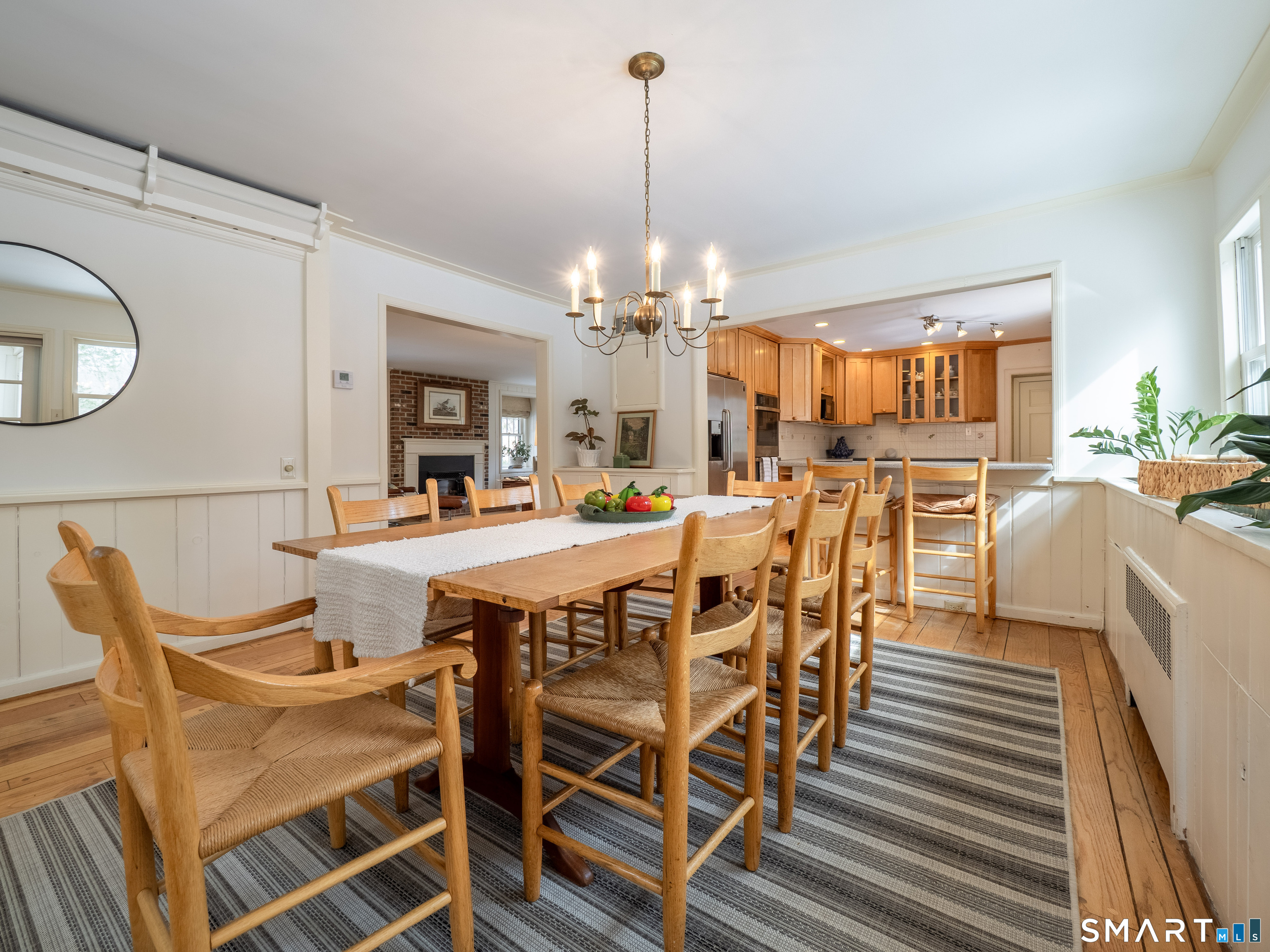 340 Sturges Ridge Road Wilton, CT 06897 - Photo 12 of 40 a dining room with furniture a chandelier and wooden floor