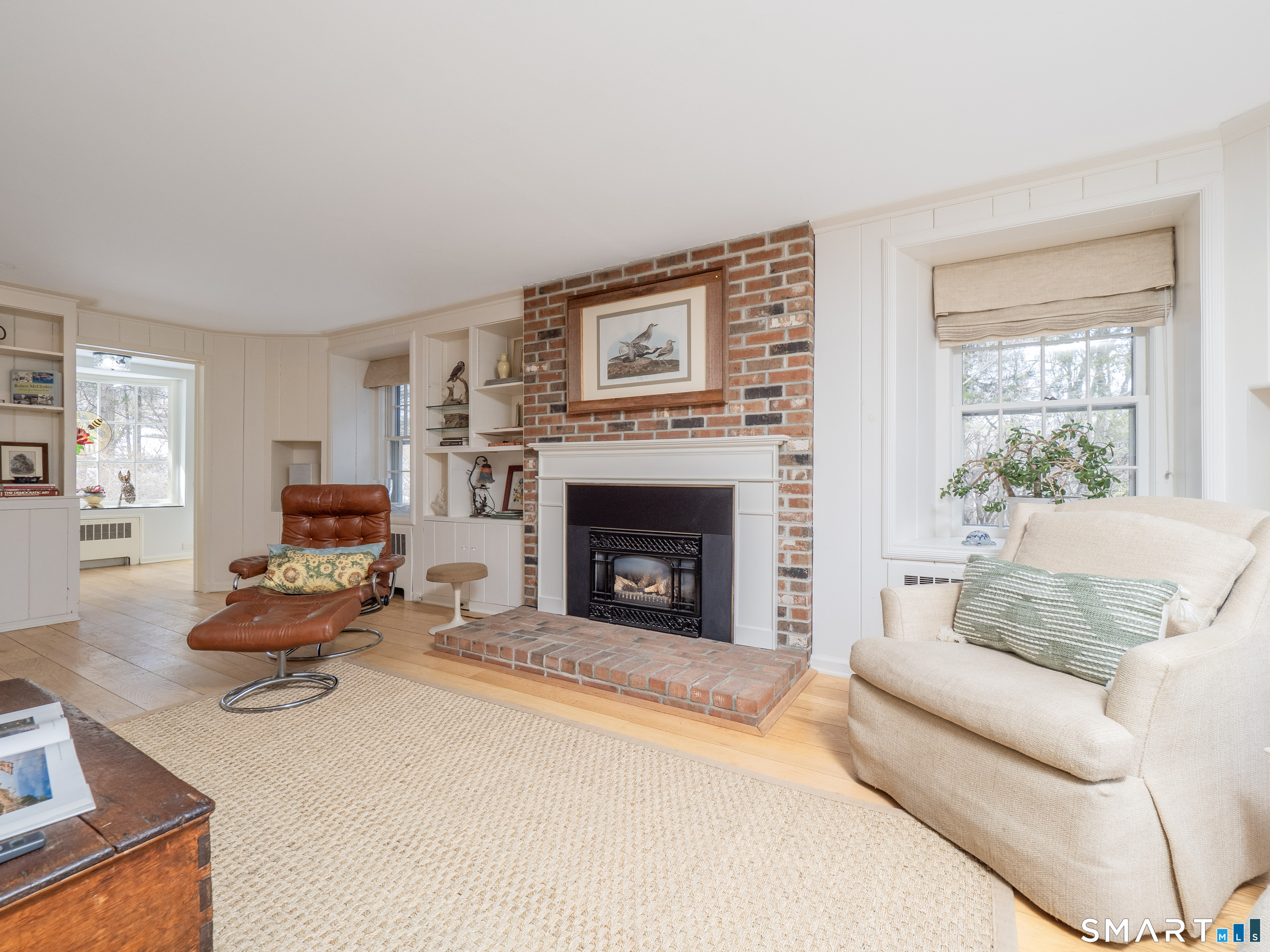 340 Sturges Ridge Road Wilton, CT 06897 - Photo 16 of 40 a living room with furniture and a fireplace