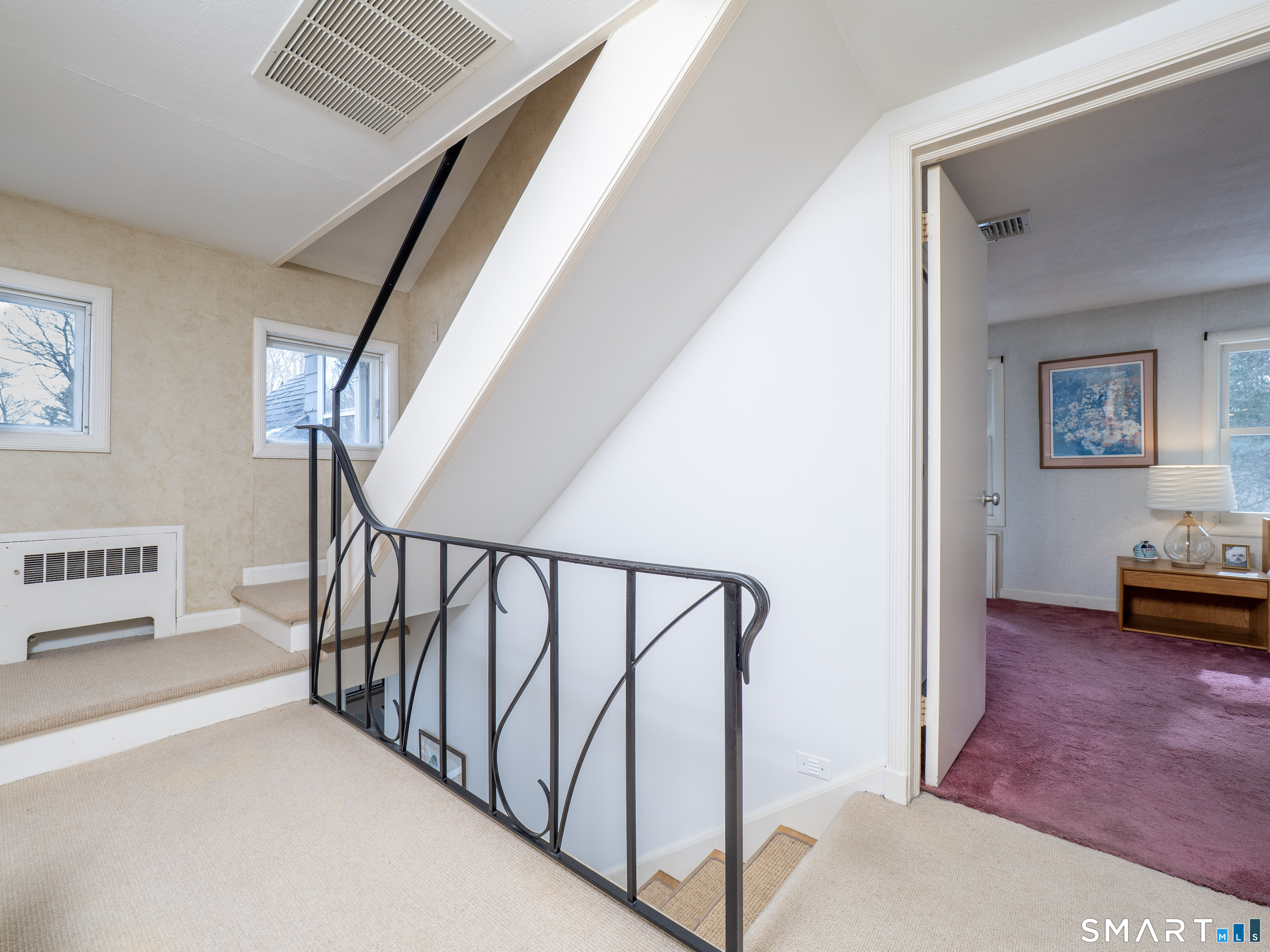 340 Sturges Ridge Road Wilton, CT 06897 - Photo 19 of 40 a view of staircase with white walls and a rug