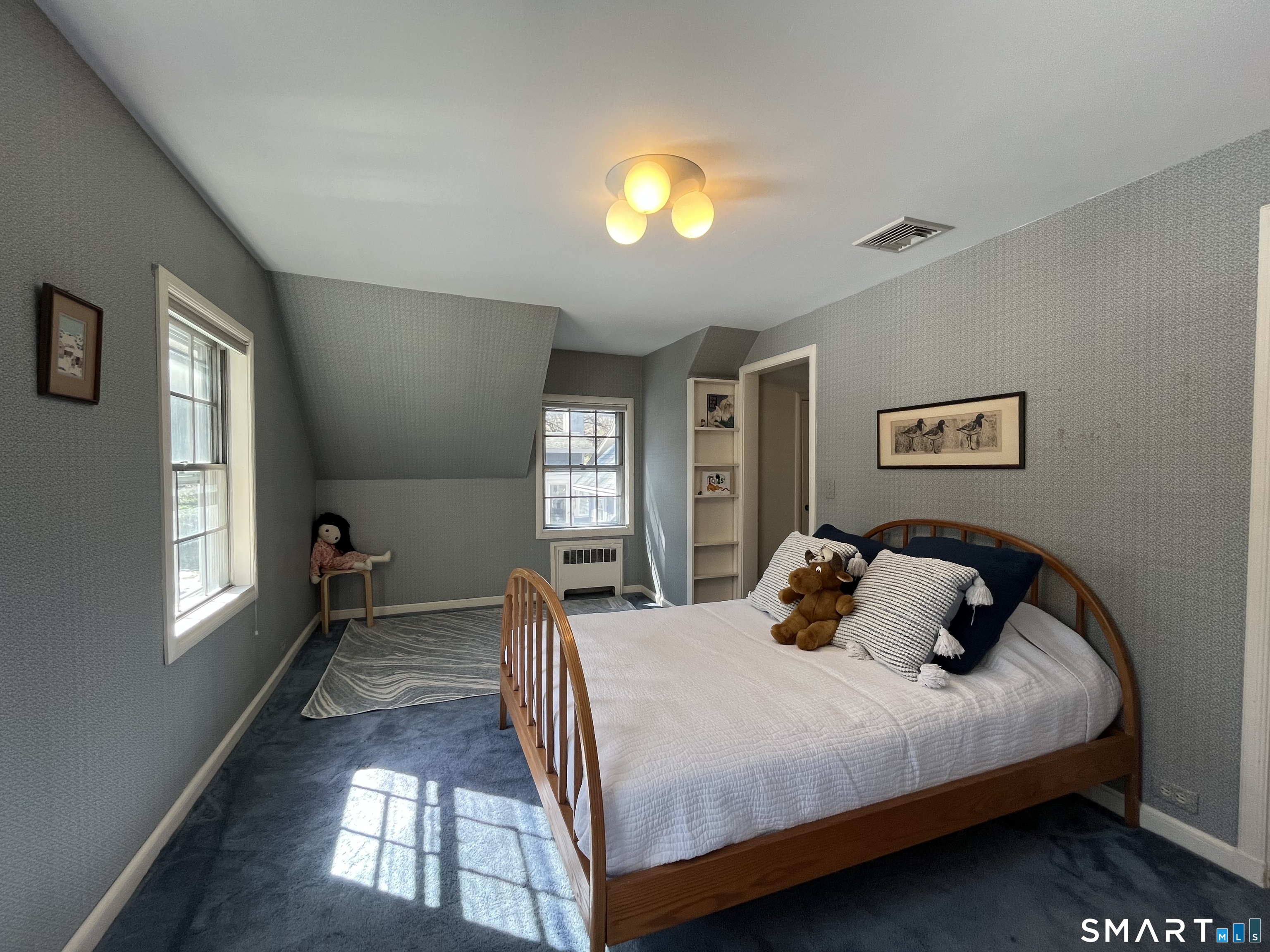 340 Sturges Ridge Road Wilton, CT 06897 - Photo 28 of 40 a bedroom with a bed and window