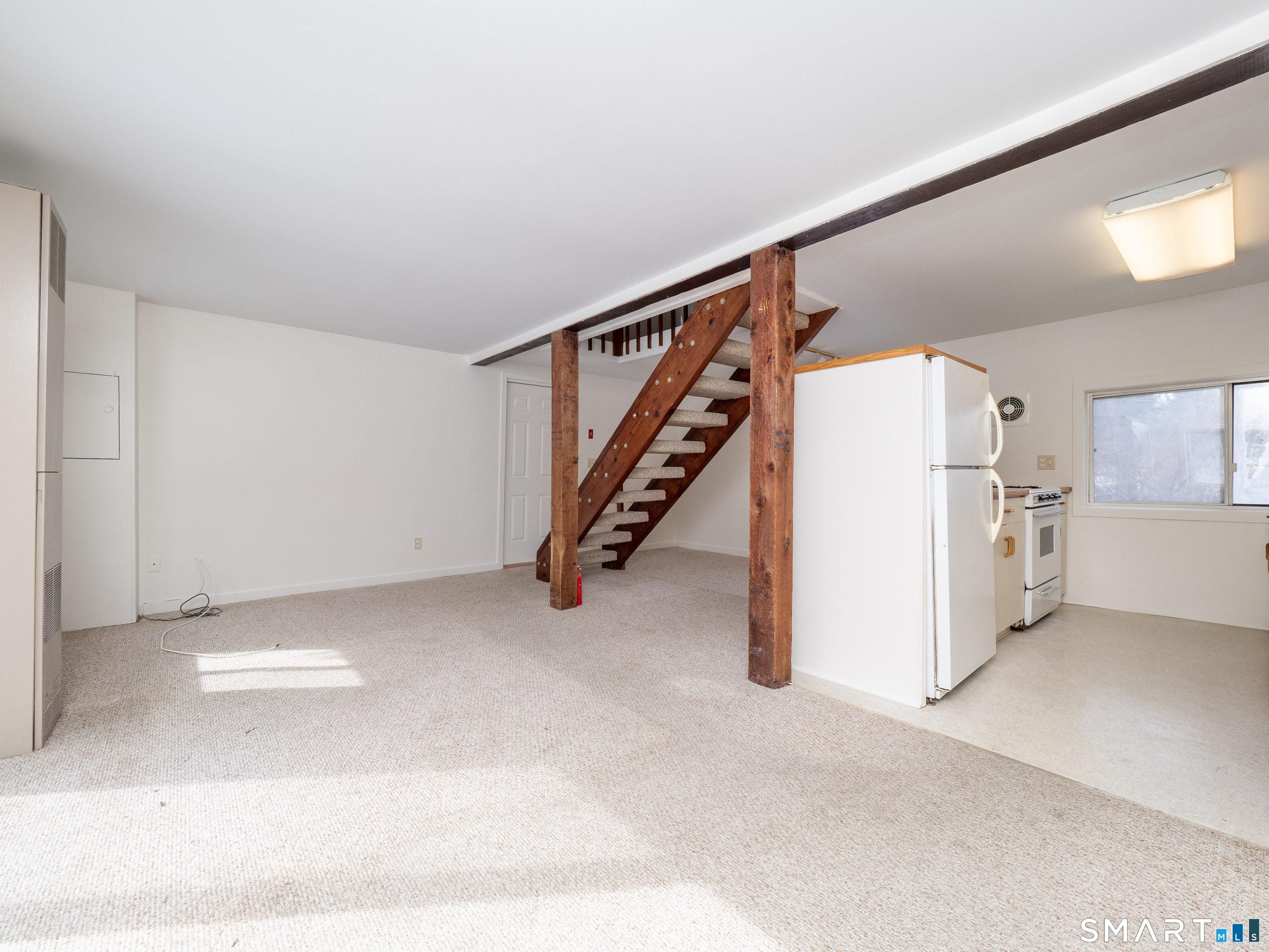 340 Sturges Ridge Road Wilton, CT 06897 - Photo 32 of 40 a view of an empty room with stairs