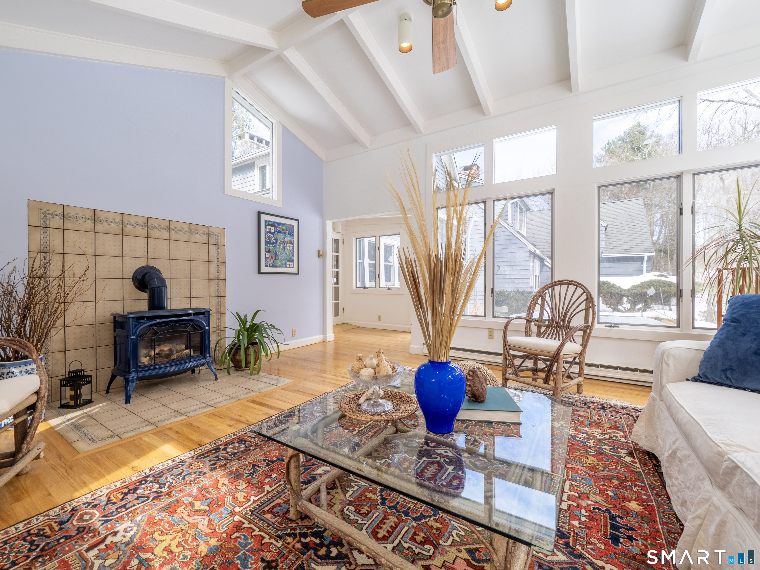 340 Sturges Ridge Road Wilton, CT 06897 - Photo 5 of 40 a living room with fireplace furniture and a table