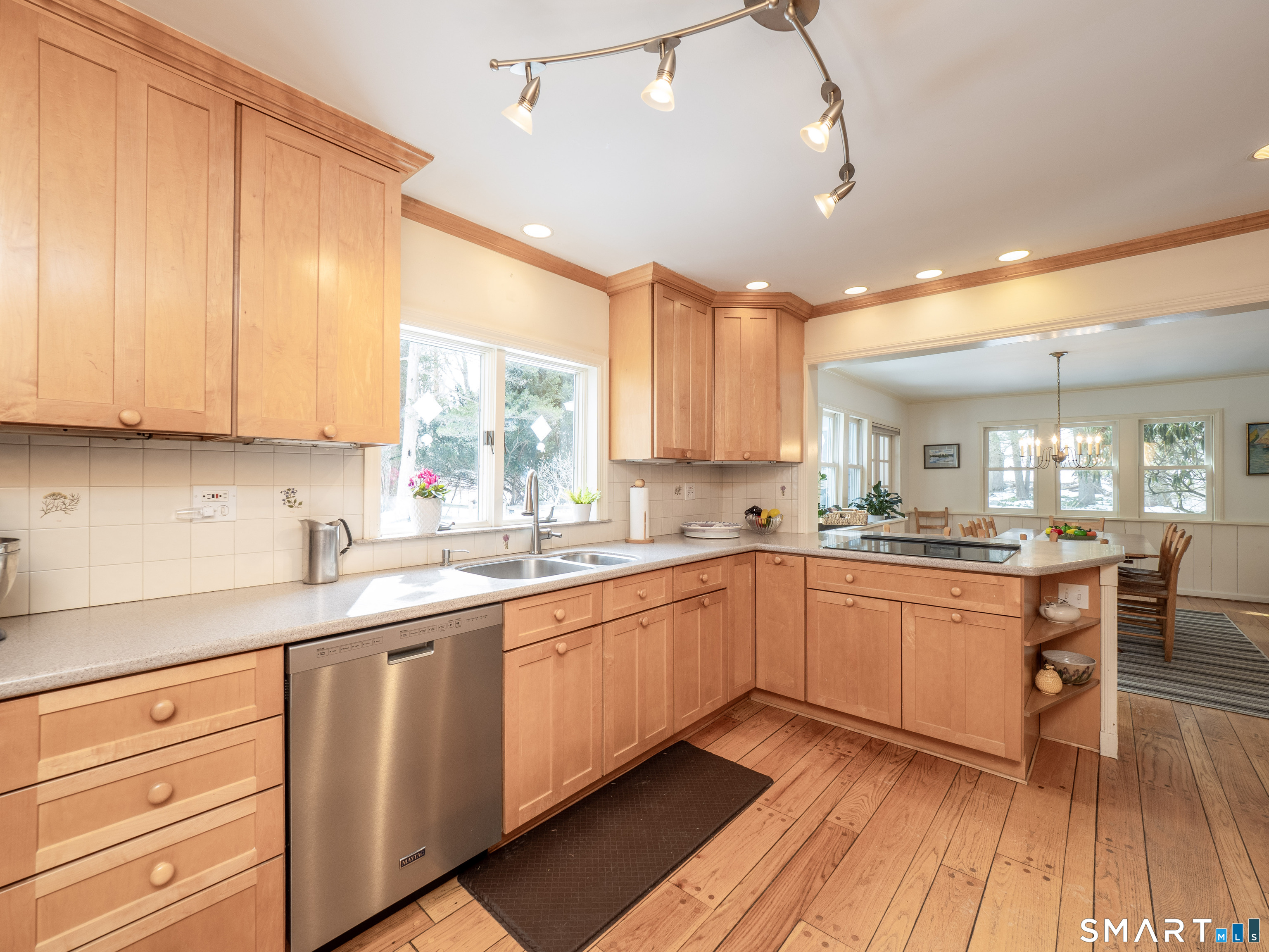 340 Sturges Ridge Road Wilton, CT 06897 - Photo 9 of 40 a kitchen with granite countertop cabinets stainless steel appliances a sink and a window