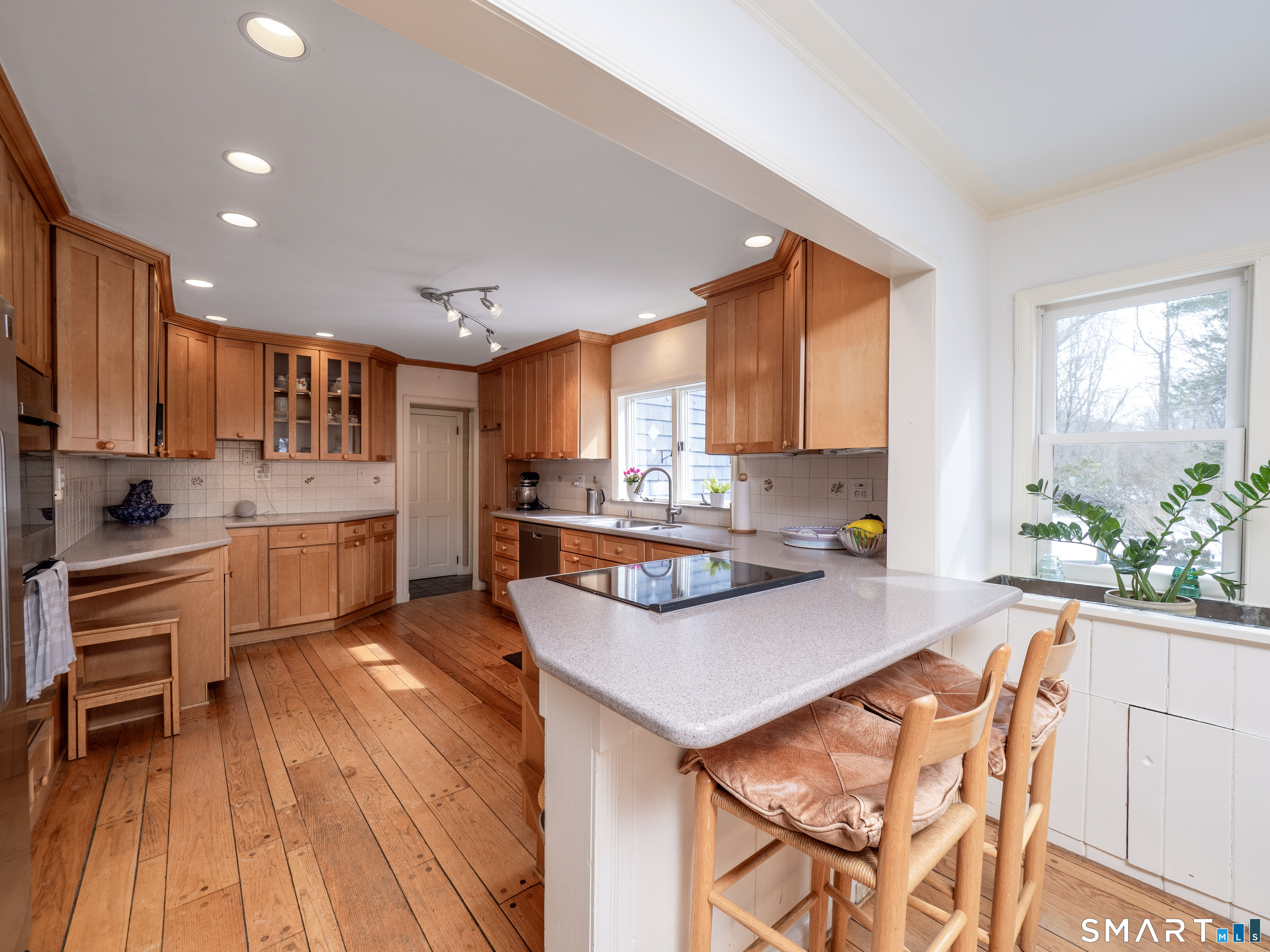 340 Sturges Ridge Road Wilton, CT 06897 - Photo 10 of 40 a kitchen with stainless steel appliances kitchen island granite countertop a stove a sink and a refrigerator