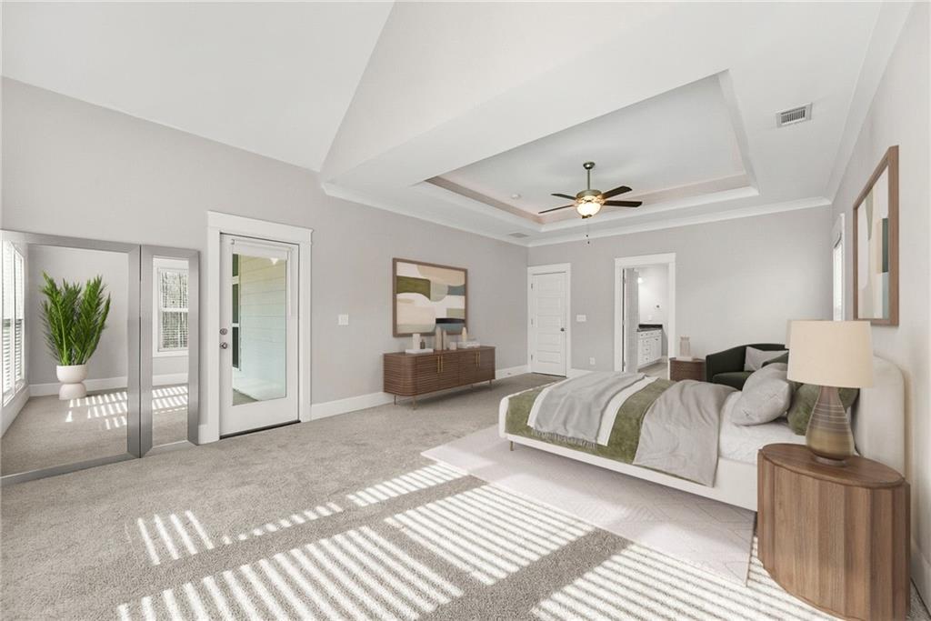 2519 Hog Liver Road Carrollton, GA 30117 - Photo 15 of 39 a spacious bedroom with a bed couch and view of living room