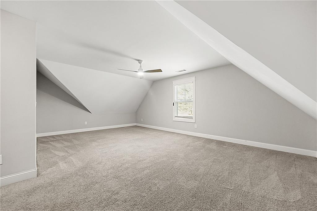 2519 Hog Liver Road Carrollton, GA 30117 - Photo 22 of 39 an empty room with windows and closet