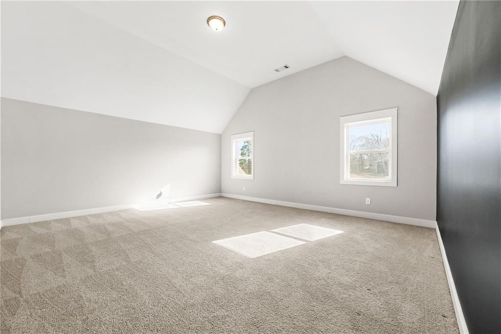 2519 Hog Liver Road Carrollton, GA 30117 - Photo 25 of 39 an empty room with windows and closet