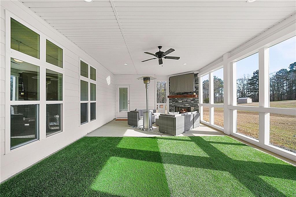 2519 Hog Liver Road Carrollton, GA 30117 - Photo 28 of 39 a view of a house with backyard porch and sitting area