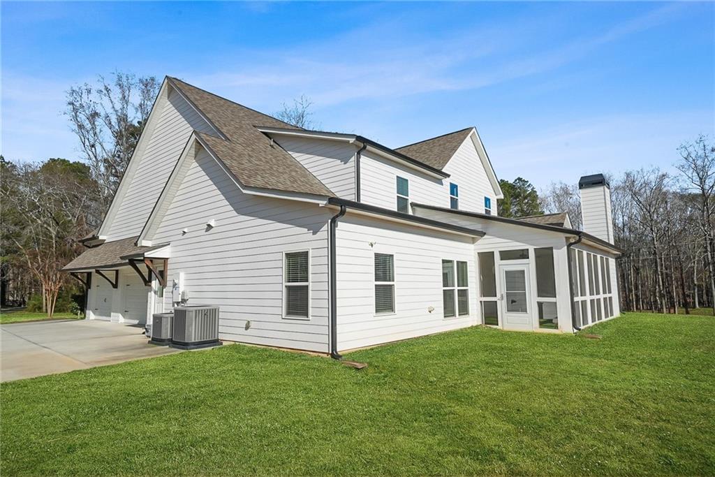2519 Hog Liver Road Carrollton, GA 30117 - Photo 33 of 39 a view of a house with a yard
