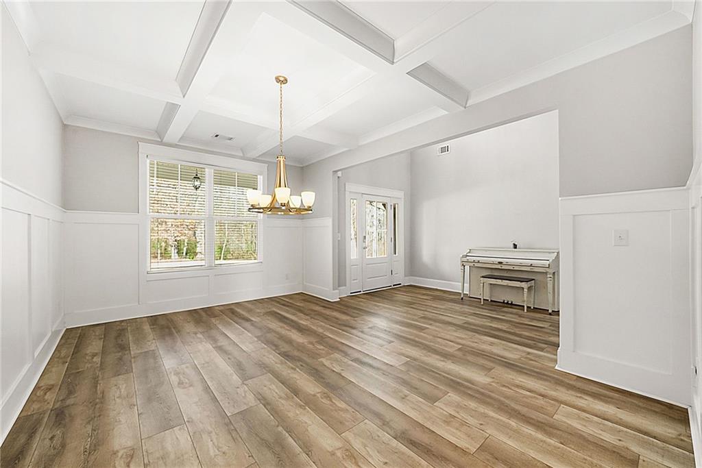 2519 Hog Liver Road Carrollton, GA 30117 - Photo 4 of 39 a view of an empty room with window and wooden floor