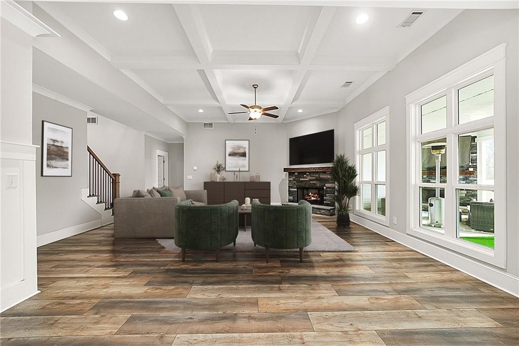 2519 Hog Liver Road Carrollton, GA 30117 - Photo 8 of 39 a living room with furniture a flat screen tv and a fireplace